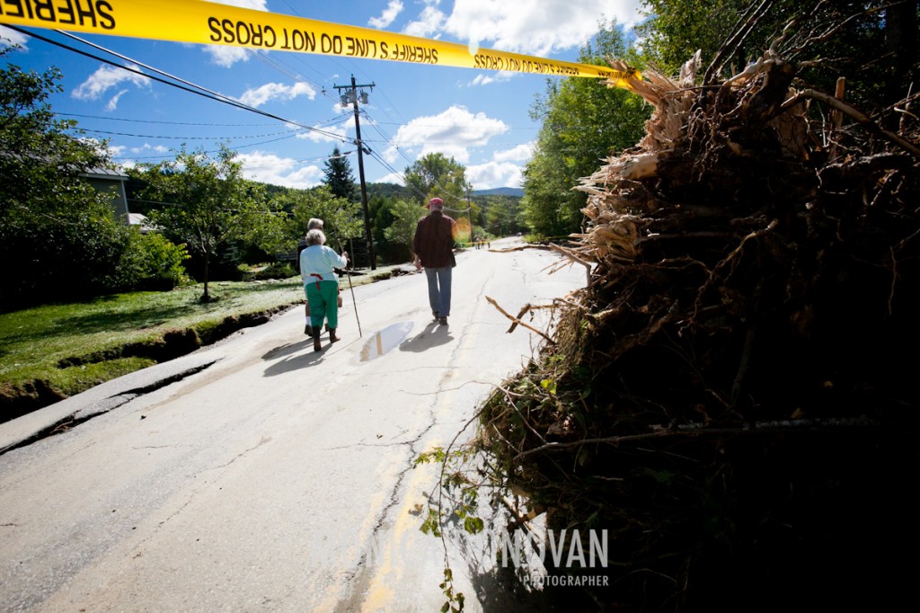 Locals survey the damage to Route 100 in Warren, Vermont the morning after Irene swept through.