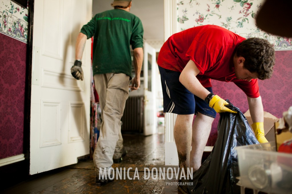 Friends and strangers clean Lucy's house in Waterbury Center, Vermont the morning after Irene swept through, filling the first floor with three and a half feet of water.